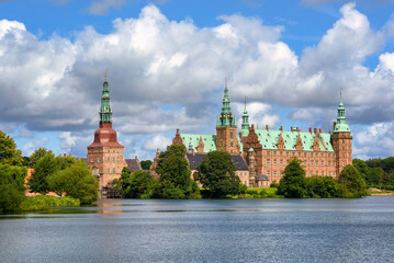 Naklejka premium Historical Frederiksborg castle on a lake in Hillerod, Denmark