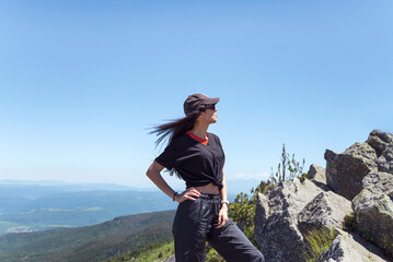 Traveler Woman on a peak in the  summer mountain .Vitosha Mountain ,Bulgaria 