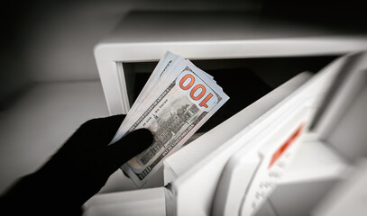 Thief steals money from a steel safe.