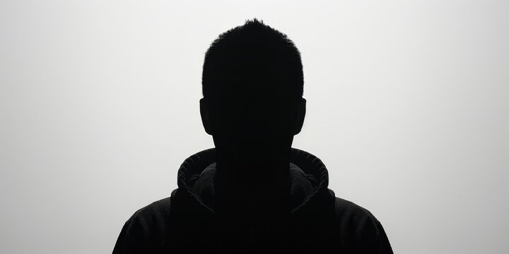 dark silhouette of unrecognizable person isolated on white background