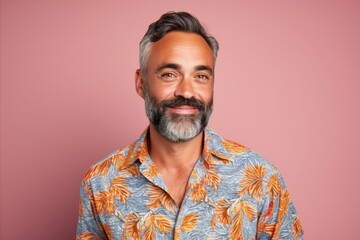 Obraz premium Portrait of a handsome mature man with beard and mustache, wearing summer shirt.