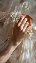 Ultra sharp image of a girl's hands delicately holding flowers against the fabric of her first