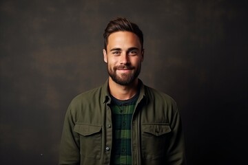 Obraz premium Portrait of a handsome man over dark background. Men's beauty, fashion.