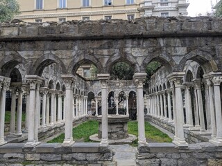 Obraz premium Columns of Chiostro di Sant'Andrea monastery in Genoa, Italy