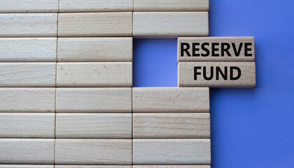 Fototapeta premium Reserve Fund symbol. Concept word Reserve Fund on wooden blocks. Beautiful purple background. Business and Reserve Fund concept. Copy space