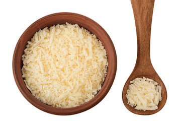 grated parmesan cheese in ceramic bowl and wooden spoon isolated on white background. Top view. Flat lay