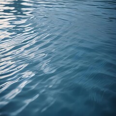 Rippling blue water surface with light reflections
