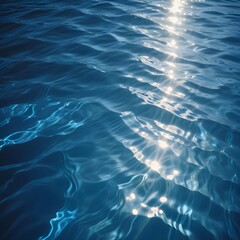 Rippling blue water surface with light reflections