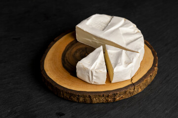 melted cheese with white mold on the table