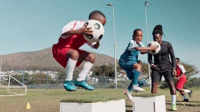 Soccer field, practice and team of kids with coach for exercise, jump and training for match. Boys, drill and children with ball in teamwork for skills development, workout and outdoor sports