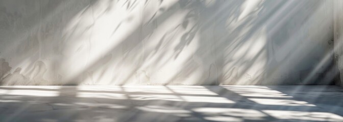 Obraz premium Blurred overlay effect for photo and mockups. Wall texture with organic drop diagonal shadow and rays of light on a white wall. shadows for natural light effects
