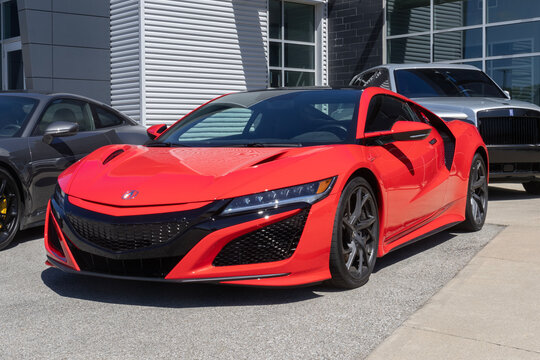 Acura NSX display at a dealership. Acura offers the NSX with a 573HP turbocharged 3.5L V6 hybrid electric engine. MY:2021