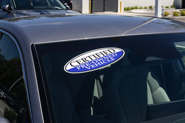 Certified Pre-Owned vehicle sign on a used car. With high price concerns, used and pre-owned vehicles are in high demand.