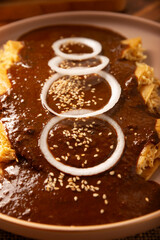 Chicken enmoladas. Also known as mole poblano enchiladas, they are a typical Mexican dish that is very popular in Mexico and the rest of the world.