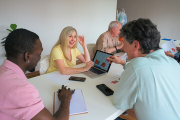 Diverse team collaborating in a modern office setting