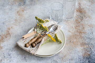 Rustic summer table setting with fresh meadow flowers