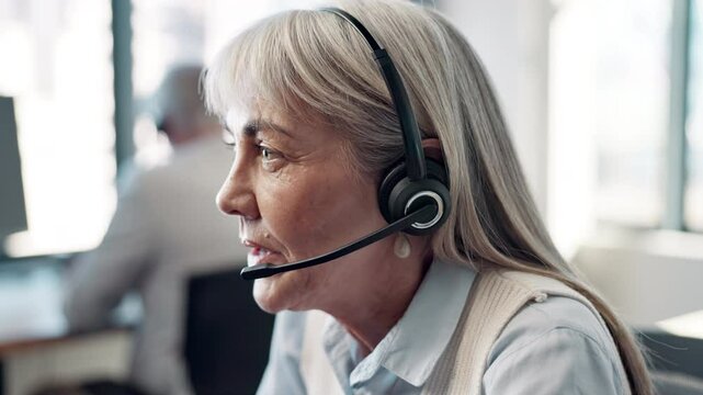 Face, mature woman and employee at call center with chat for customer support and service. Office, crm and advisor or consultant in conversation, telemarketing and communication at help desk