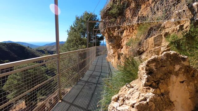 Hiking trail to Colgante bridge (Puente Colgante El Saltillo) over Almanchares river, Sierra Tejeda, Andalusia, Spain