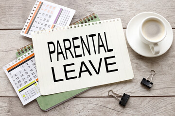 parental leave text on notepad sheet on calendar pages