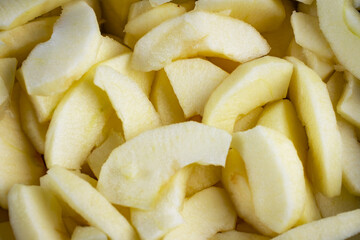 Close up view of gala apple slices in salt water.  Preparation for a pie.