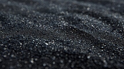 Macro Close-up of Smooth Black Sand Grains with Undisturbed Surface Texture