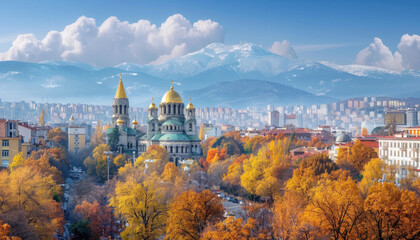 Fototapeta premium An aerial view of a city during autumn with mountains in the backdrop under a cloudy sky
