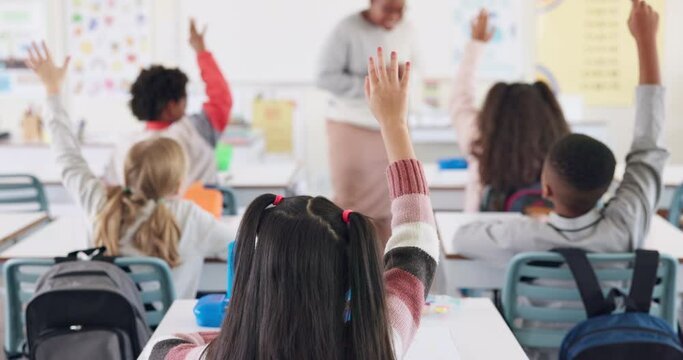 Back, children and raised hand for question in classroom with answer, knowledge and learning in education. Students, diversity group and curious at school with study, solution and feedback for exam