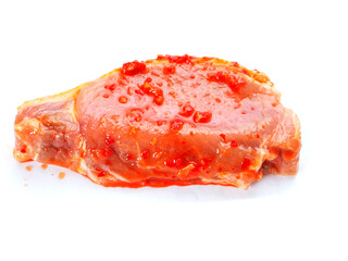 Uncooked pork chops marinated with red Asian spicy sous for barbeque or frying. Simple meat product ready for cooking. Popular meal.