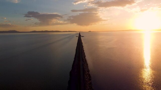 4k Aerial Views of Lucin Cutoff Divide Great Salt Lake Pink Water