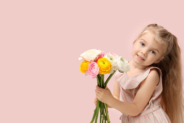 Cute little girl with bouquet of beautiful ranunculus flowers on pink background