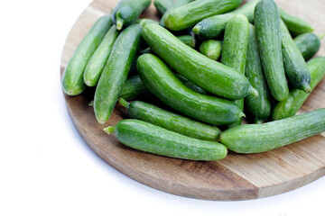 Mini cucumbers on white background.