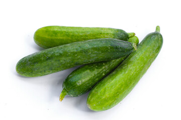 Mini cucumbers on white background.