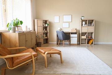 Interior of living room with workplace, blank frames and shelf units