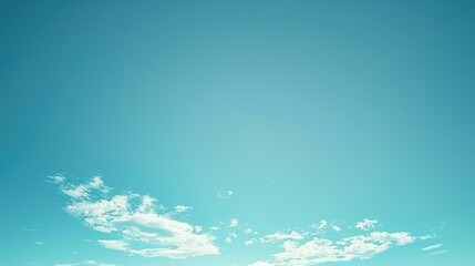 A blue sky with clouds and a white cloud in the middle. The sky is clear and bright