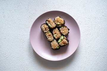 sushi rolls on a pink plate