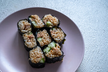 sushi rolls on a pink plate