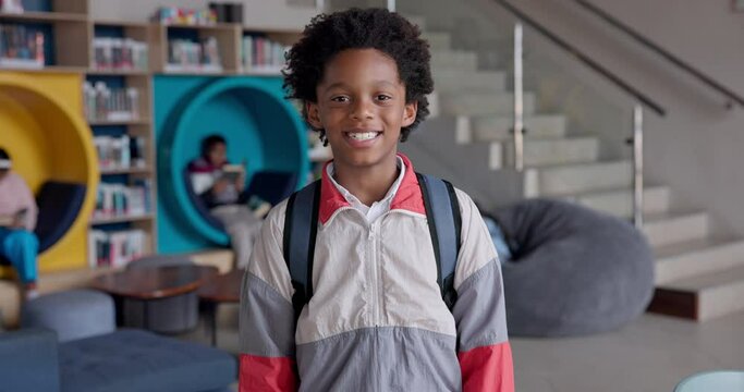 Black boy, student and backpack in library for education, learning development and happy with scholarship. Scholar, person and smile with back to school for studying, knowledge academy and growth