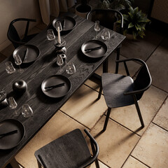 Top view of a set black table in a loft interior with decor and candles. 3d render illustration mockup.