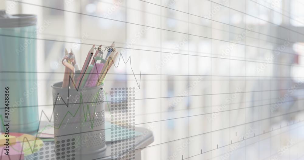 Aufkleber image of multiple graphs with changing numbers over over keyboard and pencils in office