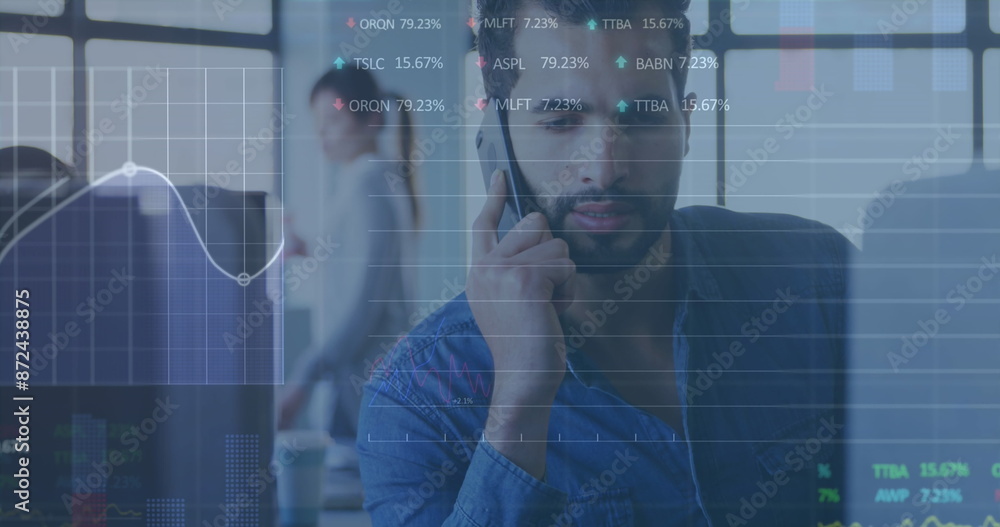 Canvas Prints Image of stock market data processing against biracial man talking on smartphone at office