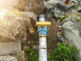 Water distribution pipes in the ground. Selective focus