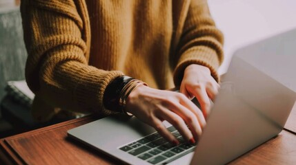 Productive Professional Person in Yellow Sweater Working on Laptop at White Desk Serene and Modern Work Environment Concept