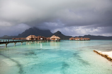 Overwater bungalows in Bora Bora lagoon, French Polynesia
