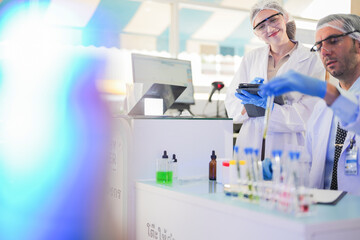 esteemed scientists elegantly dressed in lab coats are meticulously testing chemicals innovative...