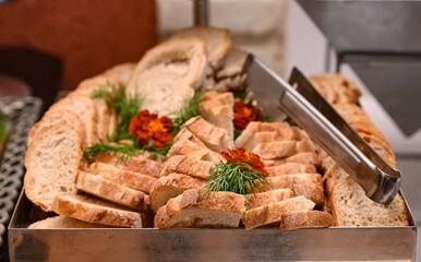breads, food on a banquet, table with food, buffet food in a restaurant, sliced ​​breads,...