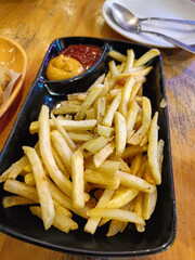 close up view of delicious asian food, french fries on table