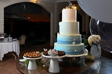 party room, birthday cake,table decoration, reception table, cake and sweet table, theme party, birthday party, cake with sea shells, maritime theme, 15th birthday party, 
a lot of balloons 