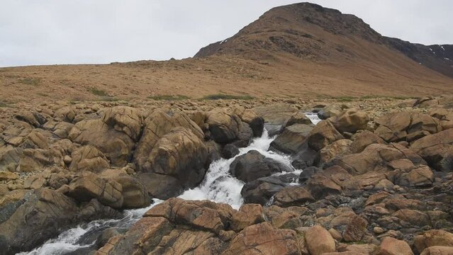 Winter House Brook meanders through a field of peridotite boulders in the Tablelands region of Gros Morne National Park, Newfoundland and Labrador.