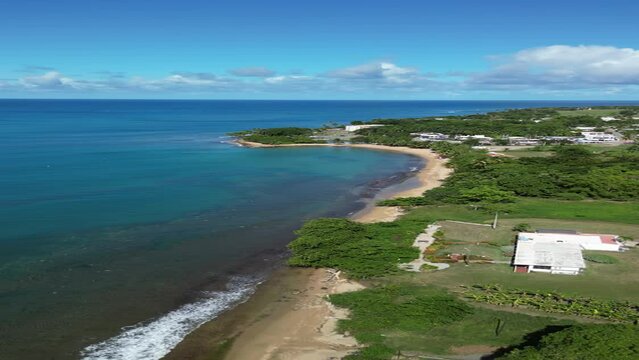 Flying above a tropical sandy beach in Rincon, Puerto Rico in the Caribbean