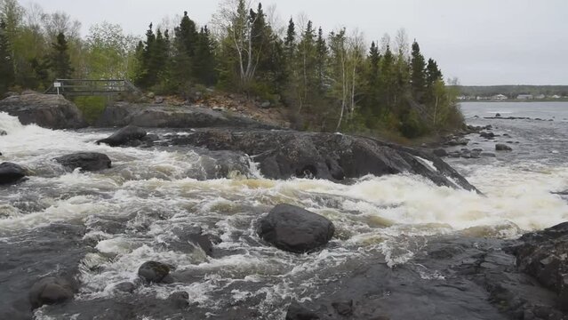 The New Bay River, also referred to as the Mill River, empties into the Southwest Arm of New Bay at Mill Point, located in Point Leamington in Central Newfoundland.
